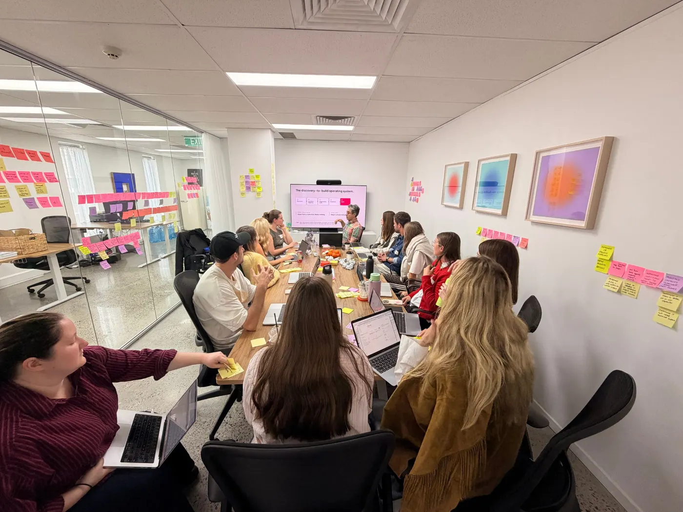 The Bread Agency team watching a presentation during their Learn and Build workshop